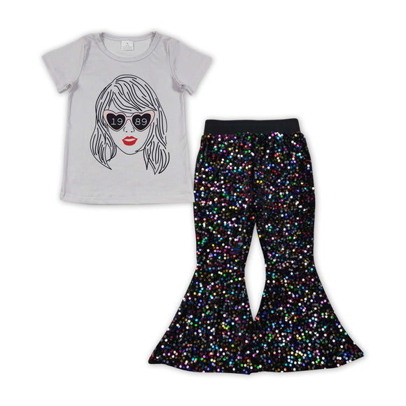 Hear glasses top black sequin pants singer girls outfits